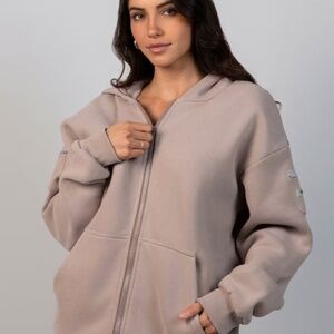 Travel Essentials Zip Up Hoodie (NWT/ never worn)  - Size Medium in color "Bark"